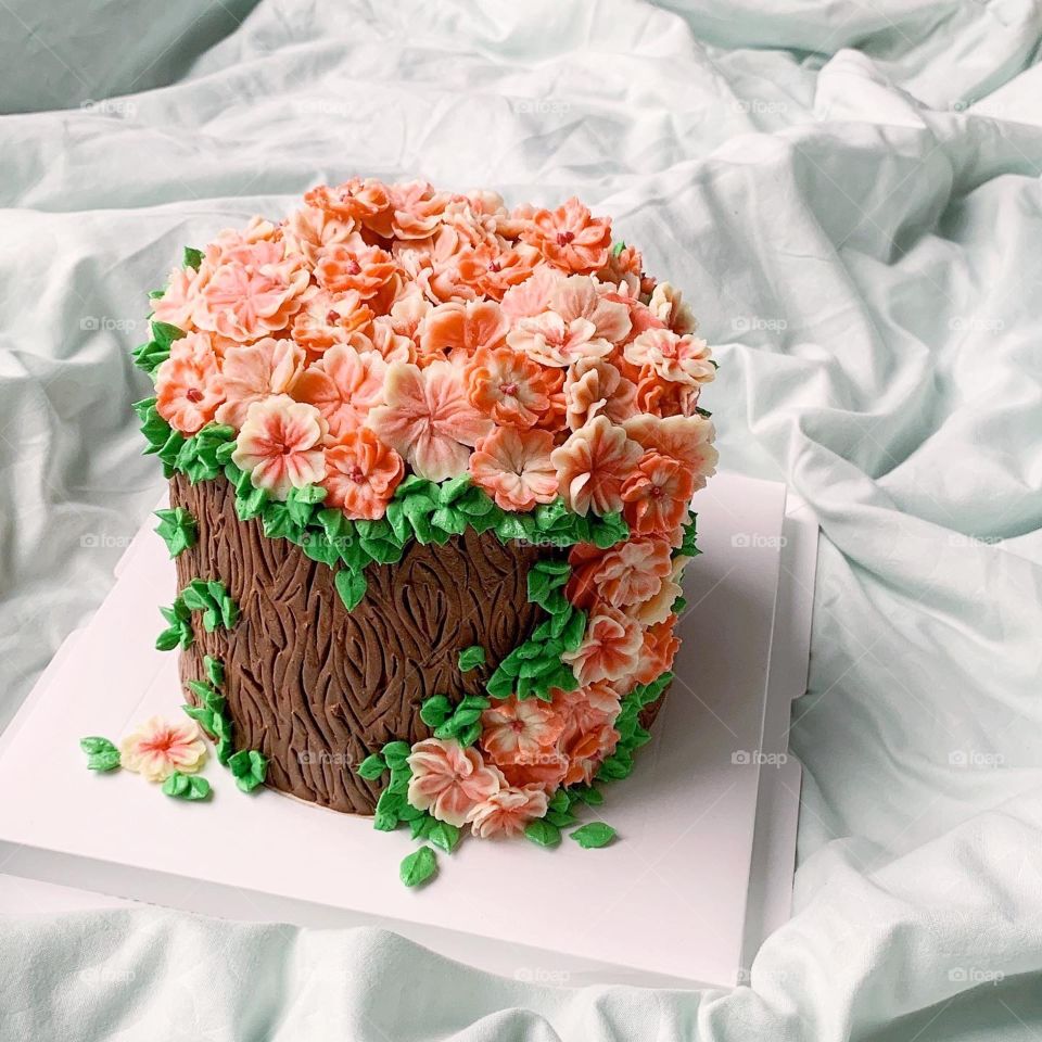 Homebake gorgeous 3D pink log edible floral buttercream cake with chocolate and vanilla and strawberry fillings 