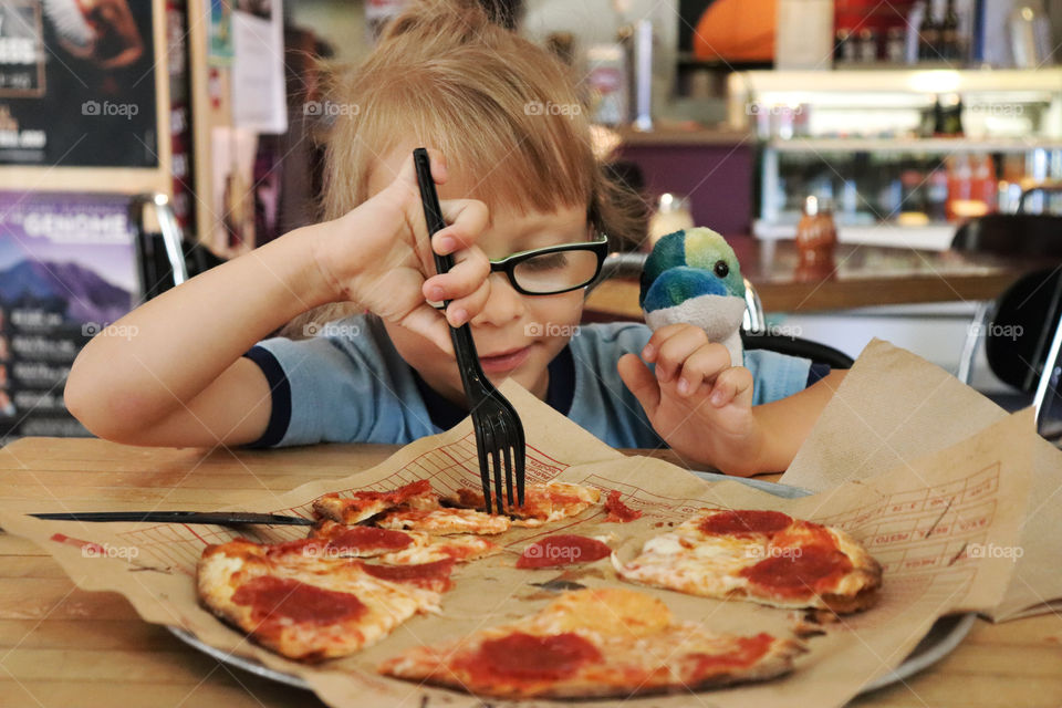 Child eating pizza