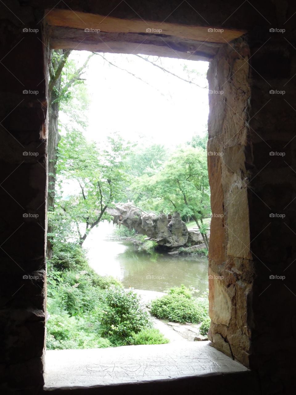 Wooded Window. picturesque river running through the woods scene at the Old Mill in Little Rock, Arkansas.