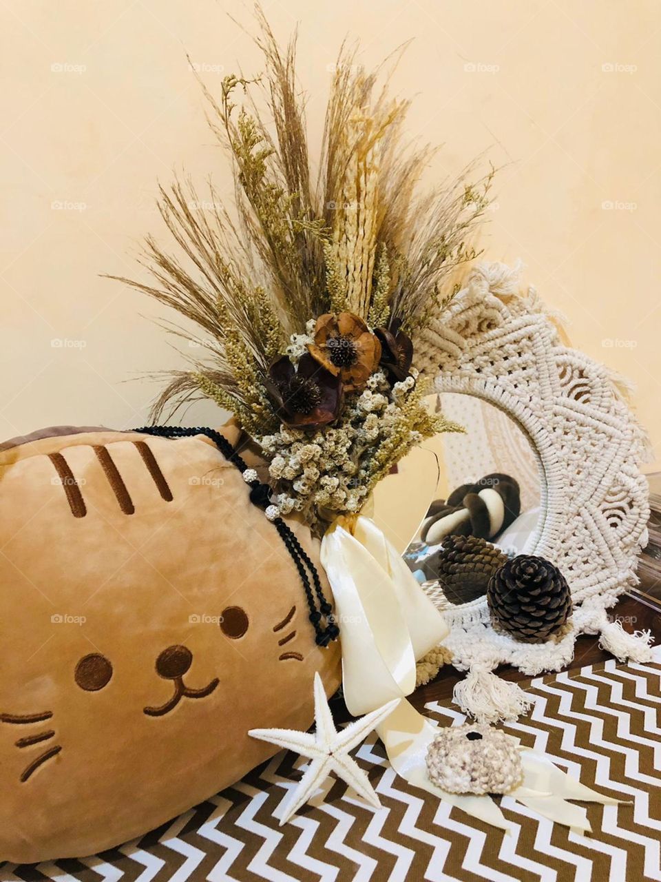 a doll and wall hangings are perfect for a home with an aesthetic feel