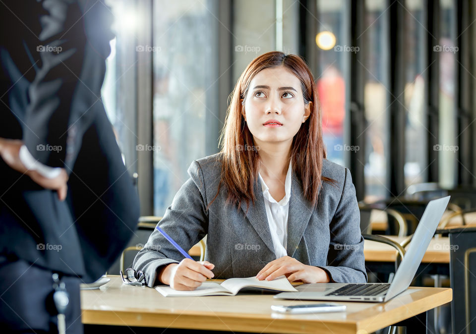 Business woman sitting on bench