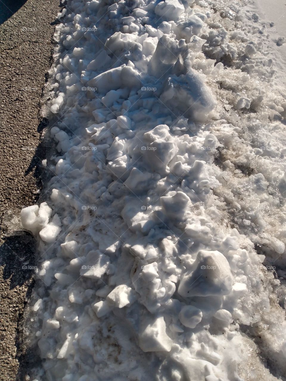 the residue of our snow has been pushed to the side of the roads to melt away.