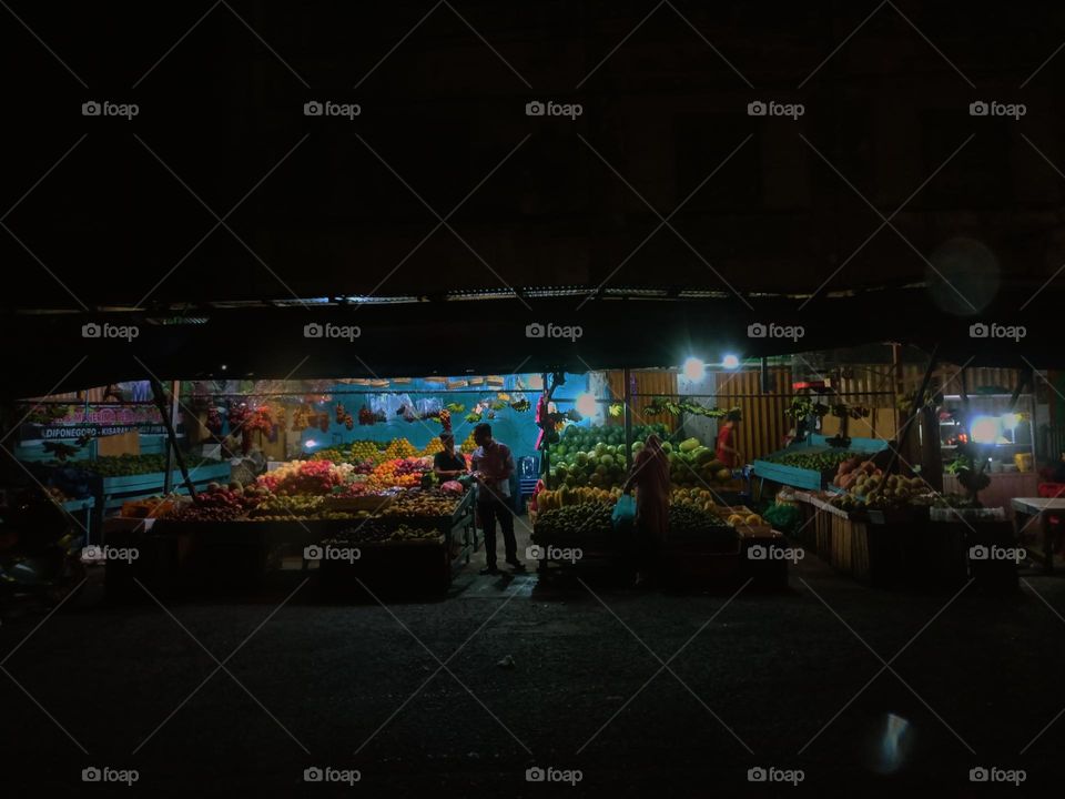 Night view of a traditional store by street. Long exposure, blured and defocused