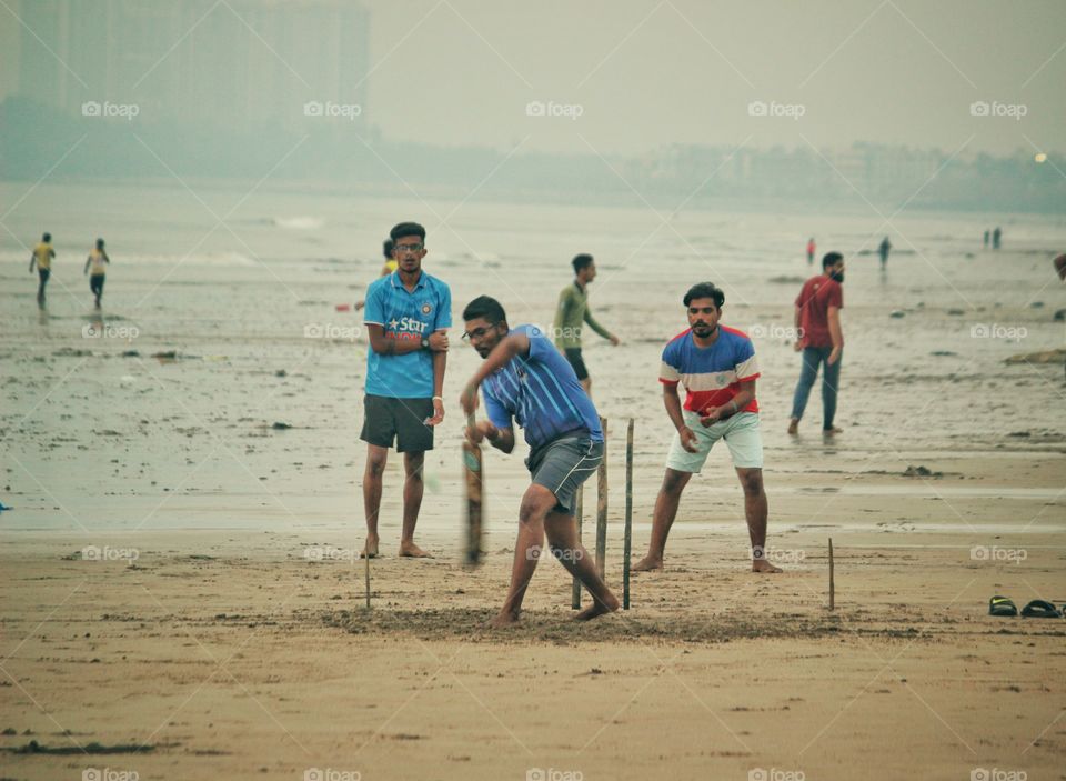 Sunday evening at beach... cricket... a most loved game in India....
