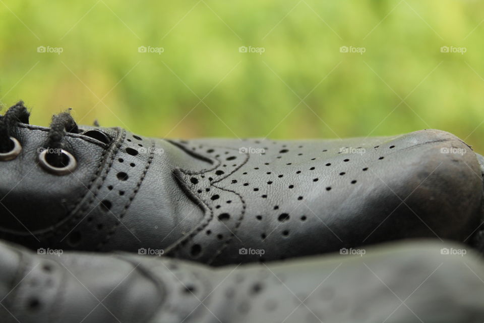 Old boots, black leather, black boots, beautiful boots, patterned boots, shabby boot, green background, pattern, shoes, sneakers,