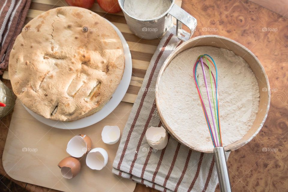 Making homemade puffed apple pie with eggs, sugar and flour.