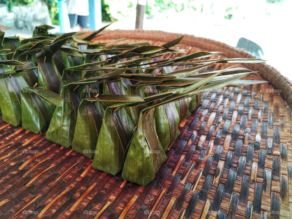 Many steamed flour with coconut Filling are on the threshing basket. Kanom Sai Sai in Thailand.