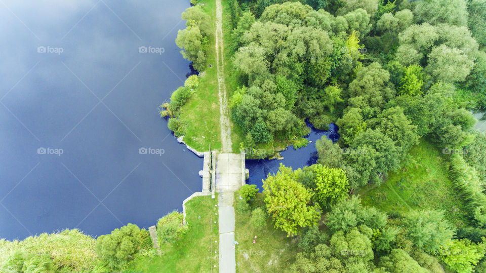 Dam on the middle of the lake and forest. 