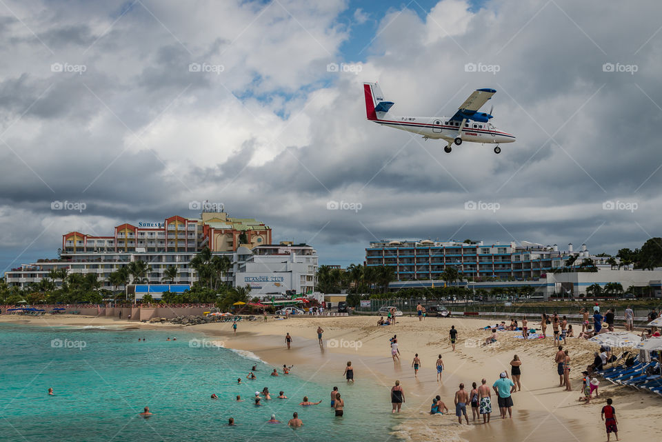 Small plane landing just over a beach on St. Maarten 