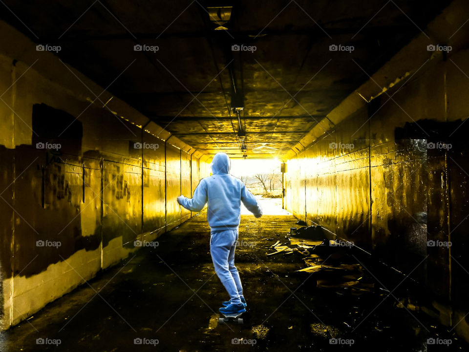 Skateboarding Through A Tunnel