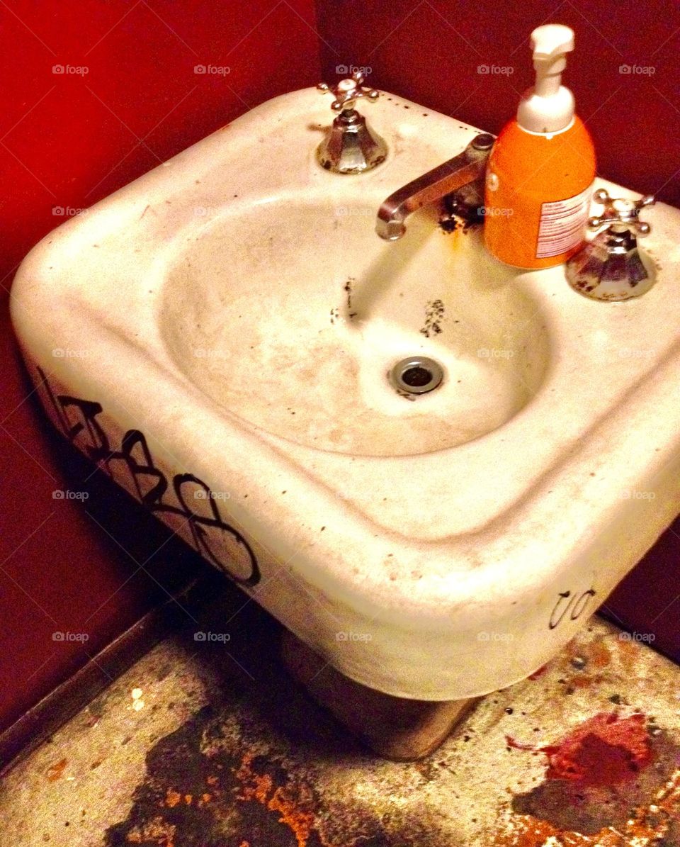 Decrepit looking sink found in a bar in New Orleans.