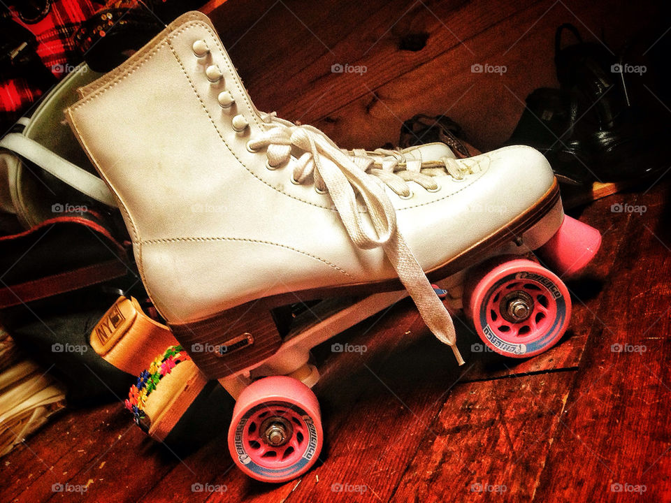 Vintage roller skate with pink wheels