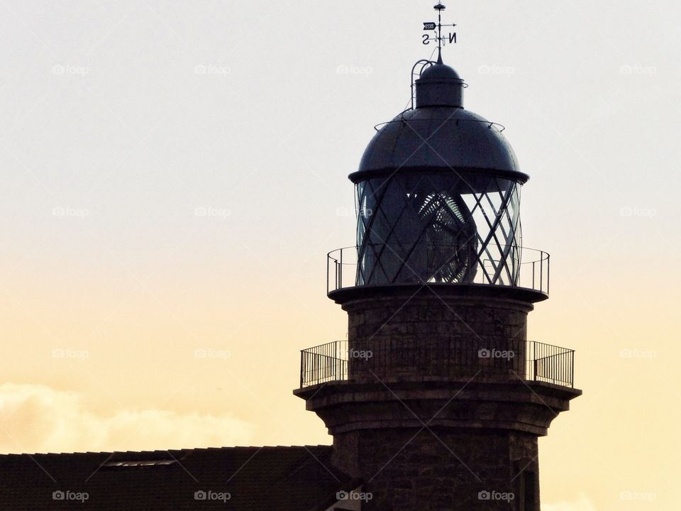 Tower of a lighthouse at sunset