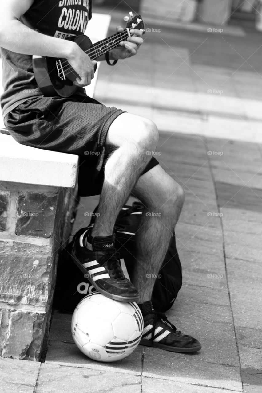 As we were enjoying an outdoor festival this kid was busking, both singing and playing on his ukulele, and doing tricks with the soccer ball. A very talented young man! 