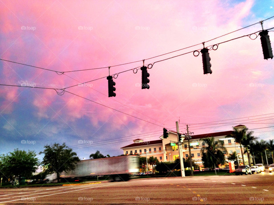 Truck rushing in the street at sunset