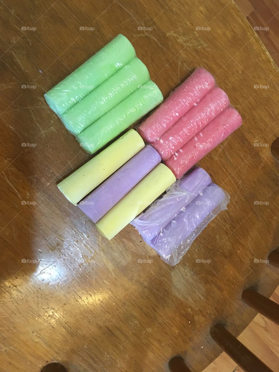 Color of spring, sticks of chalk green,yellow pink and purple  colors of the rainbow.