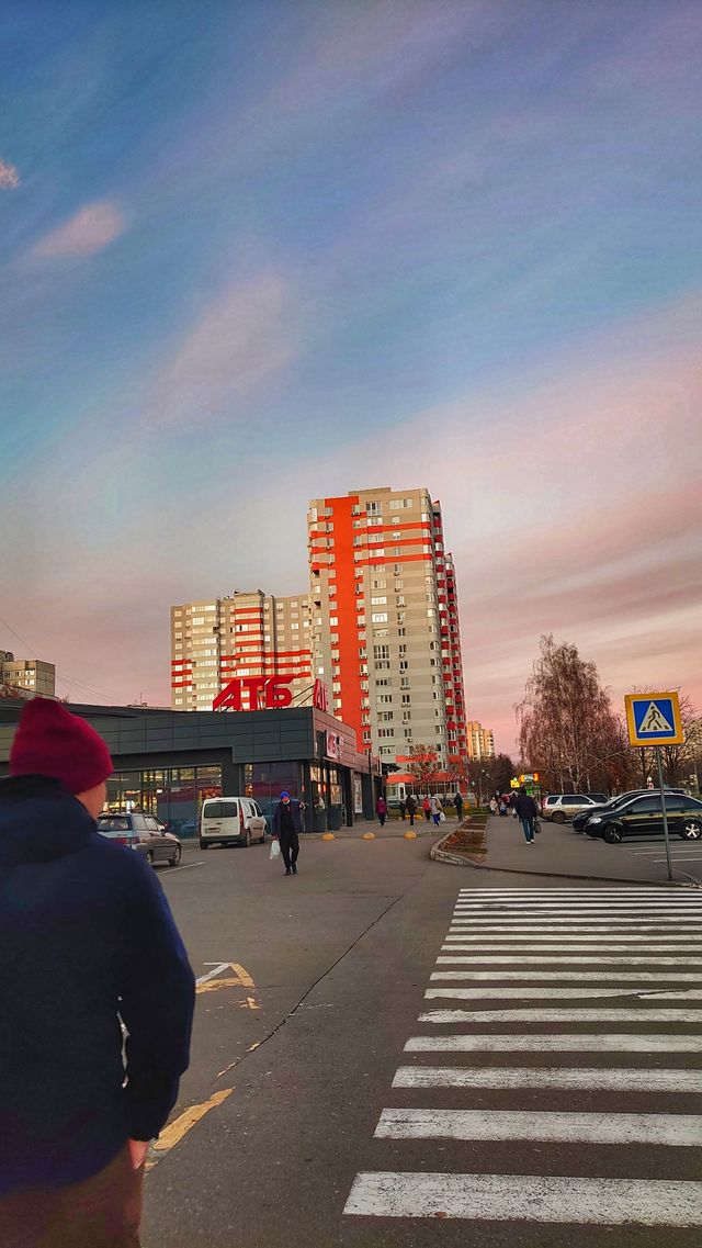 autumn city sunset on the background of a large apartment building