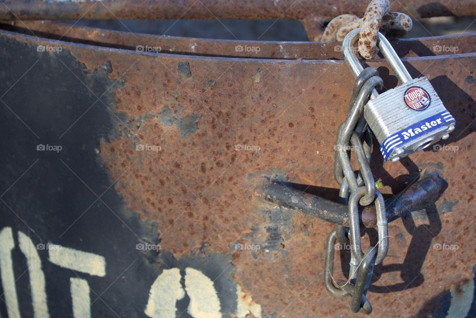 Chain locked on a charcoal pit. 