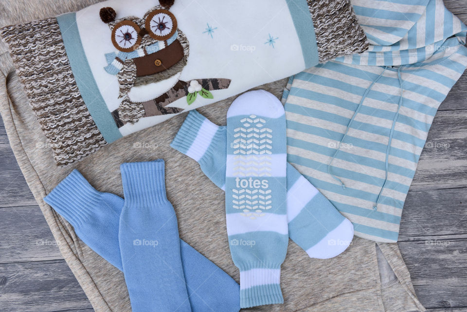 Flat lay of blue slipper socks with other blue items