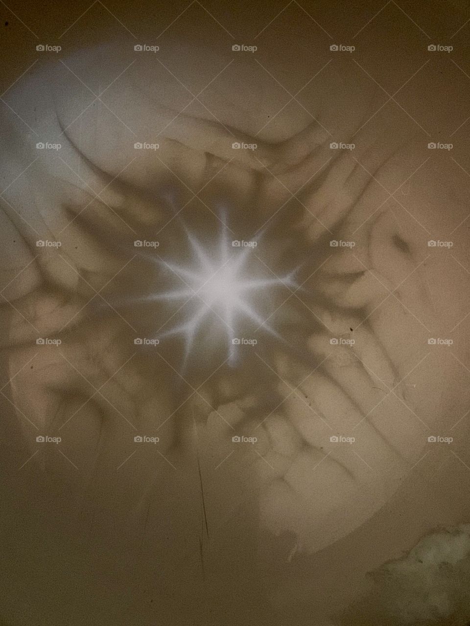 Like a snowflake. Natural soy wax while cooling going from its liquid state to into solid forms a snowflake shape. 