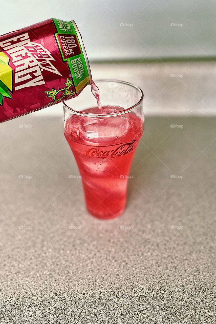 Pouring Mountain Dew Energy drink into glass with ice, making a cold drink, making a cold energy drink in the morning, daily morning routines, pouring drinks into glasses, Mountain Dew Energy drinks product shot 