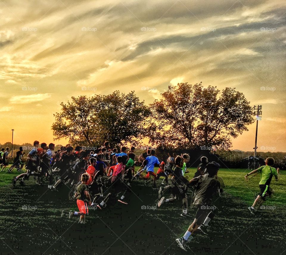 Cross Country runners under October sunset