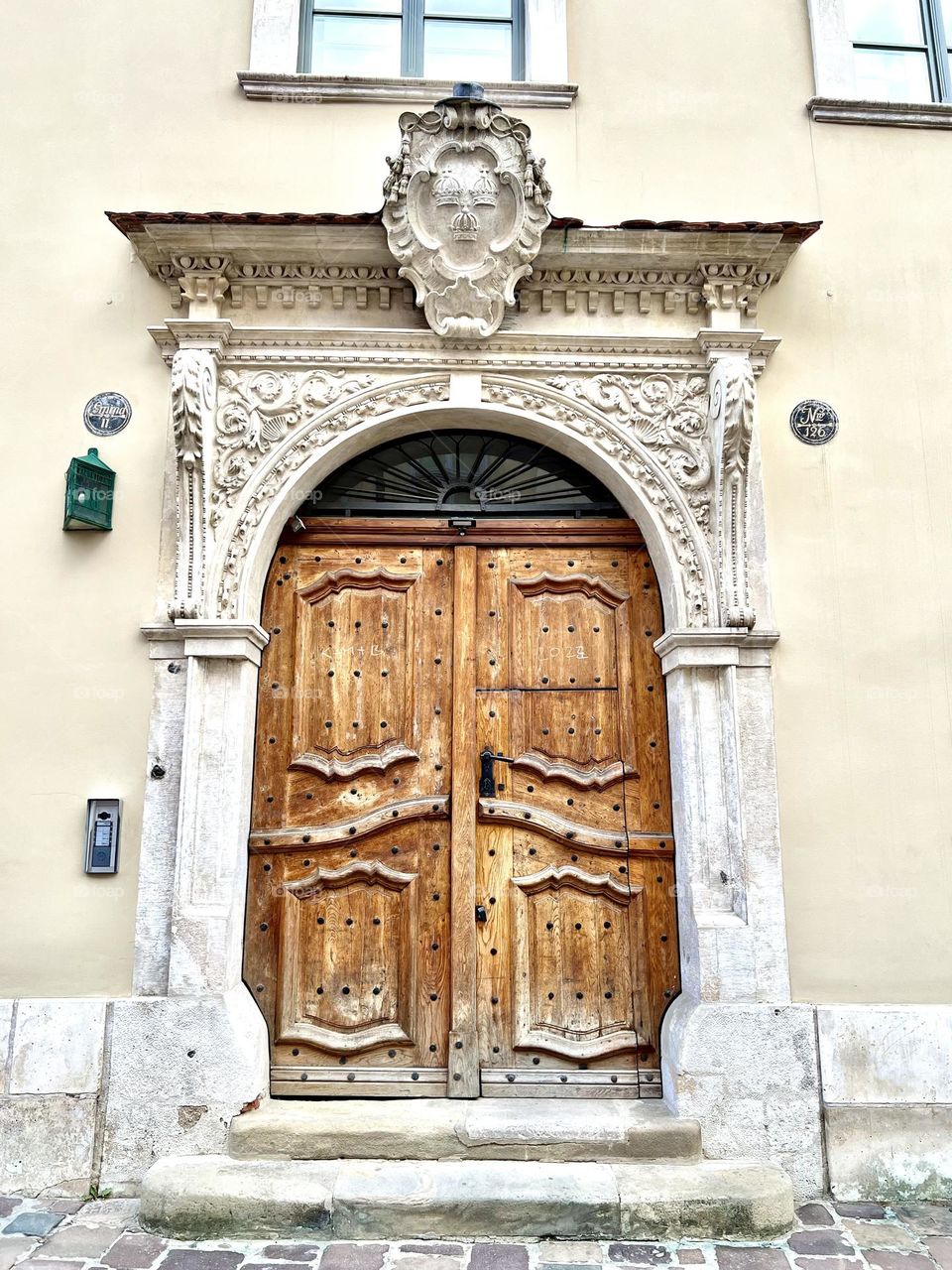 Coat of arms of the Krakow Cathedral Chapter. Krakow, ul. Kanoniczna 18