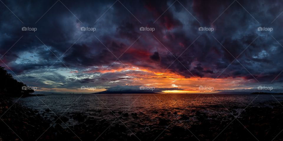 Dramatic sky during sunset over sea