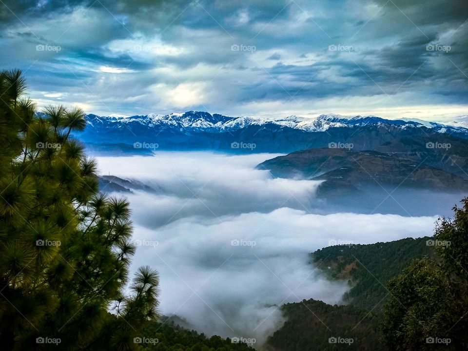 clouds between the mountains, cloudy sky view.
