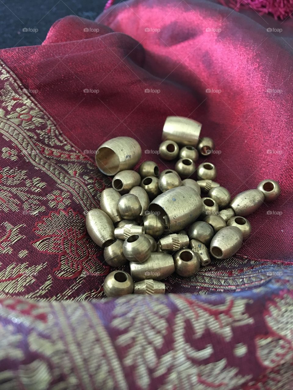 Brass beads on fancy fabric 