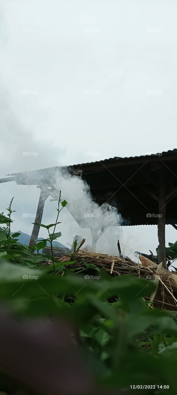 smoke billowed near the farm hut.