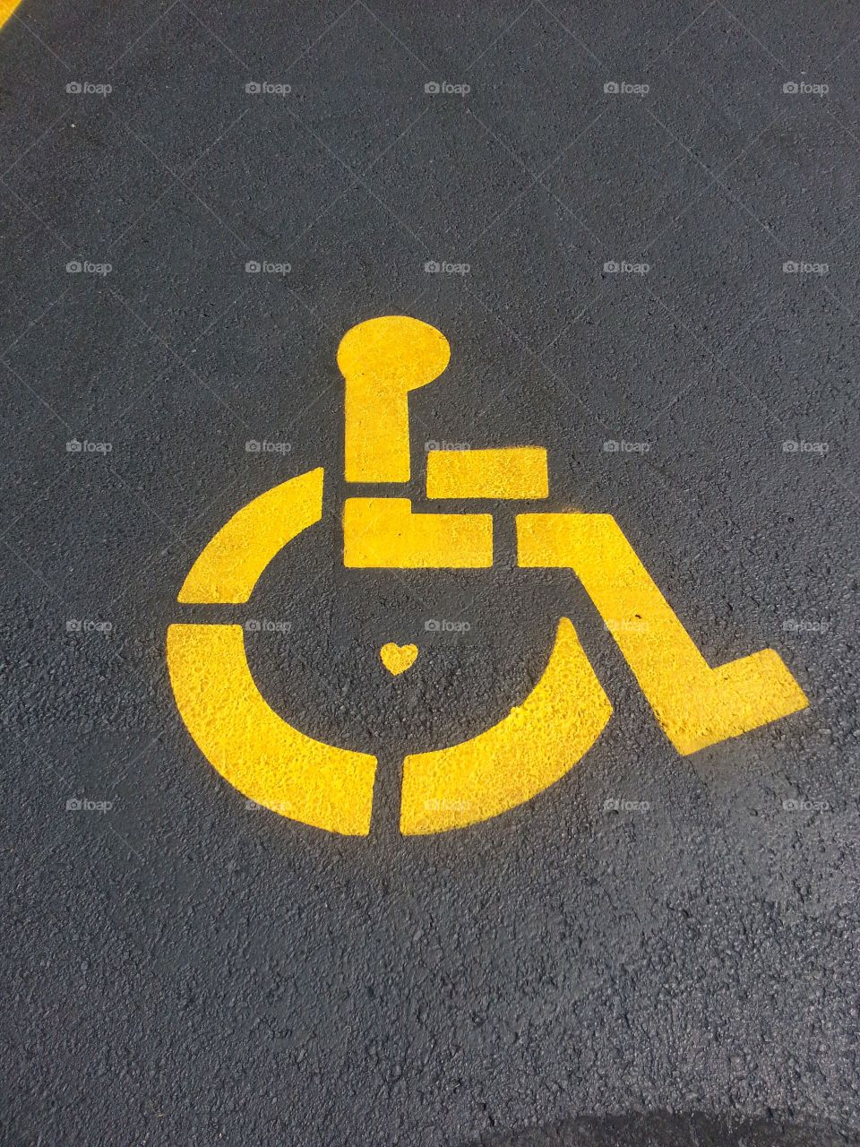 Handicap sign. Love this! First time I saw handicap signs with a heart in the middle.
