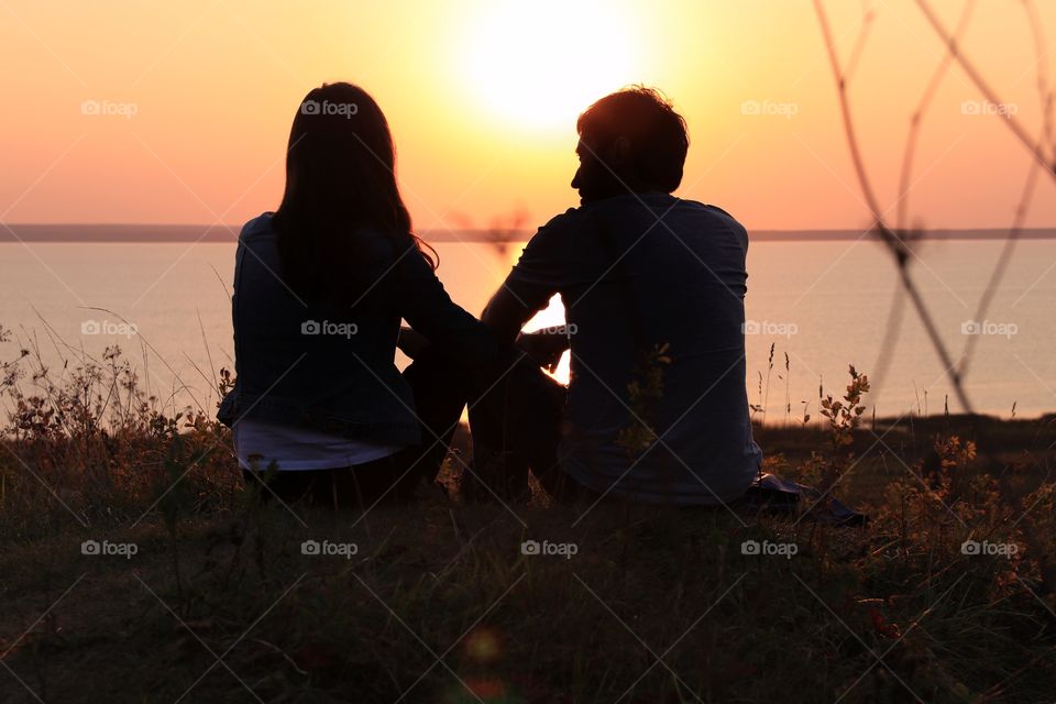 silhouette couple in love on the sunset