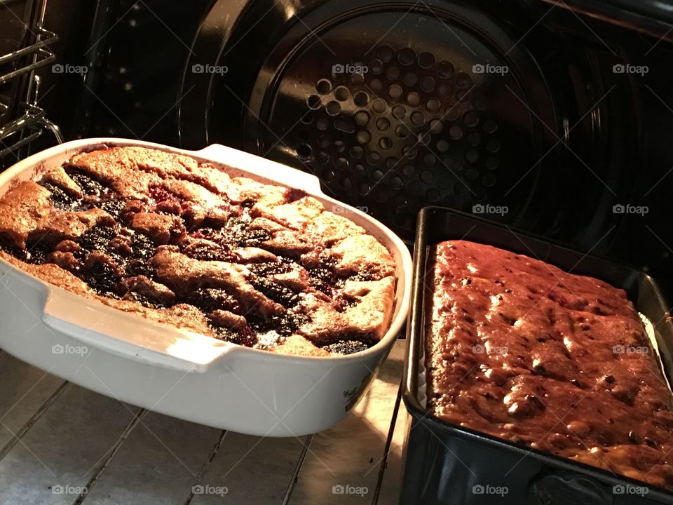 Cobbler and bread in the oven. Mulberry fruit cobbler and mulberry fruit and banana bread in the oven