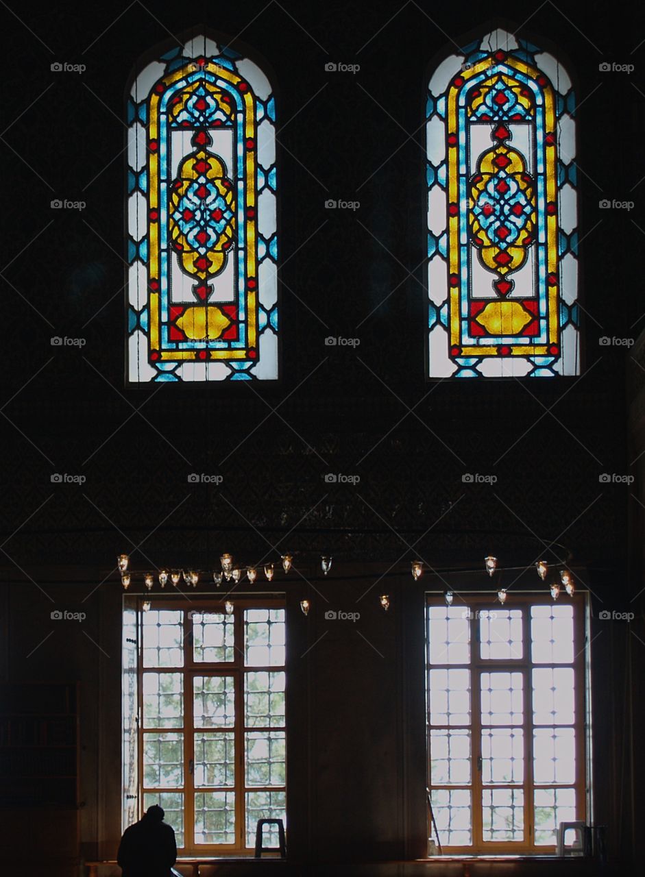 A man praying inside at a mosque in Istanbul, Turkey