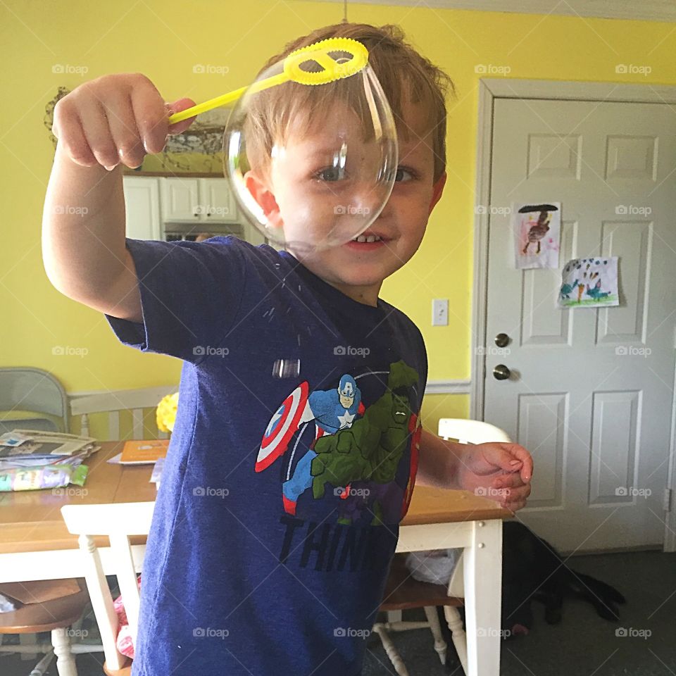 Boy holding bubble wand