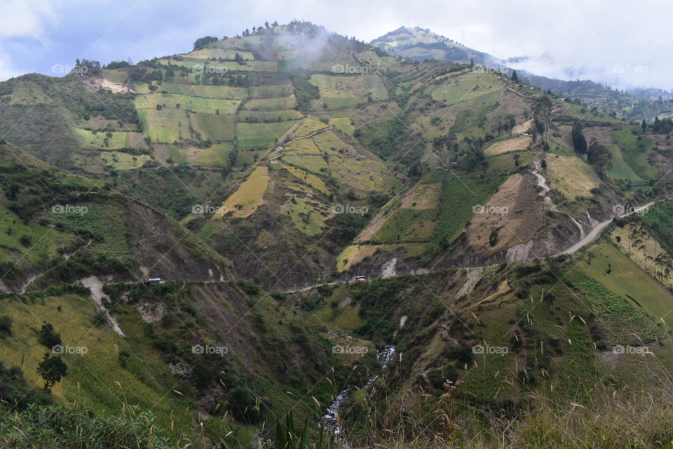 Hillside fields of Ecuador are green with grass