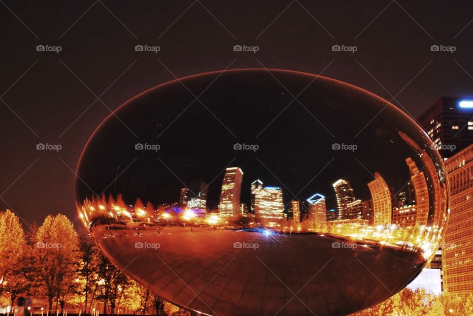 Night Reflections in the been. The being also known as cloud gate reflecting the cities skyscrapers at night in the summer