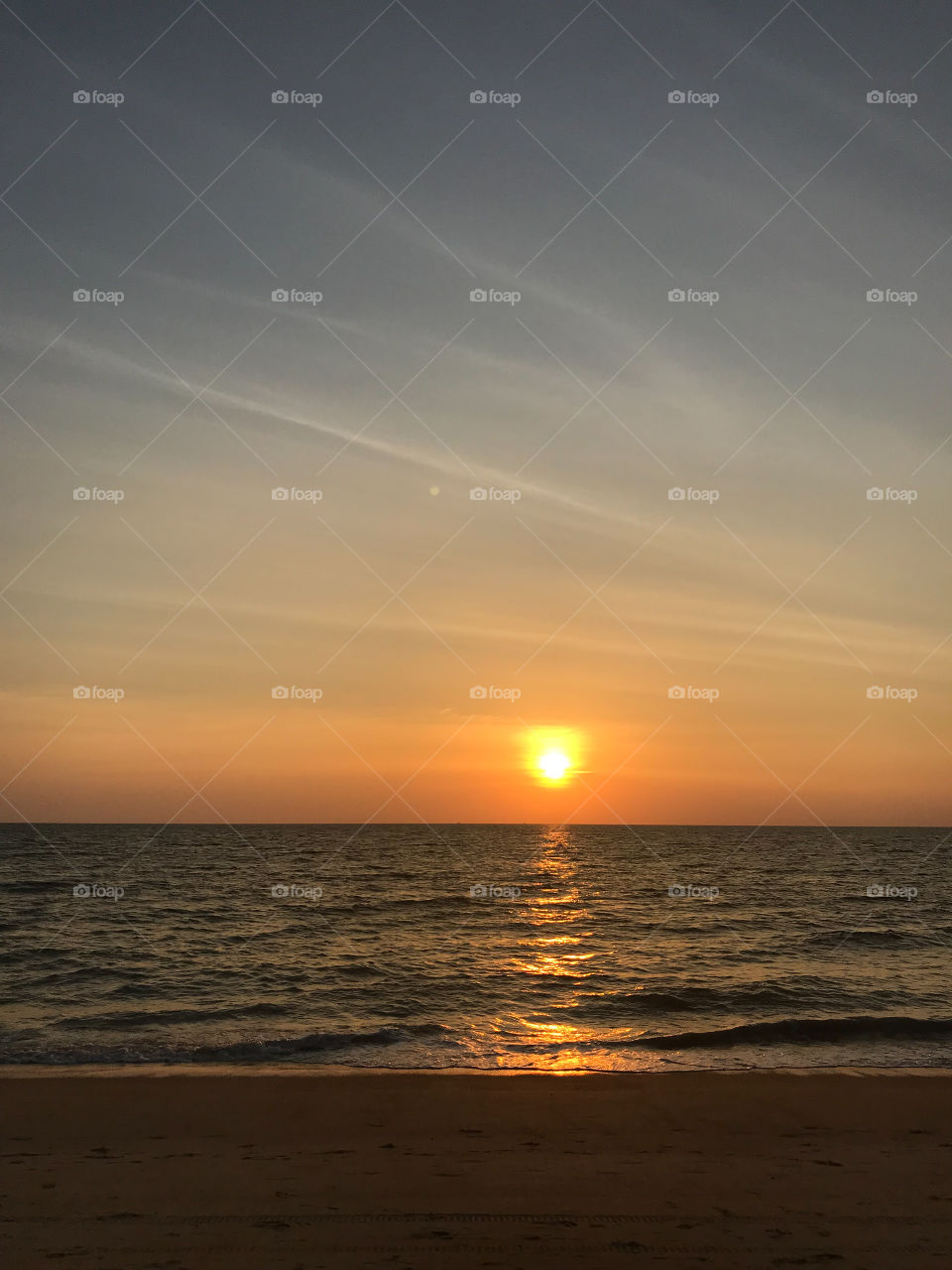 amazing vanilla sky and ocean beach when sunset with sun reflection on sea surface