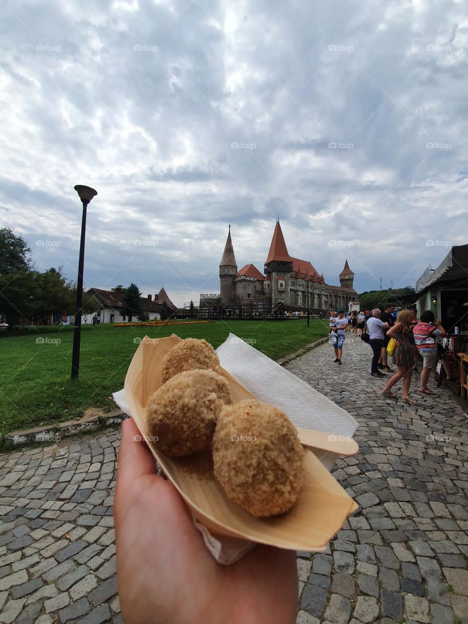 Sweet plum dumplings in front of Hunedoara Castle