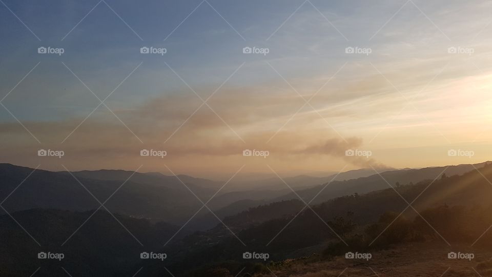 Sunset with distant forest fire, Terras de Bouro, Peneda-Geres National Park, Portugal