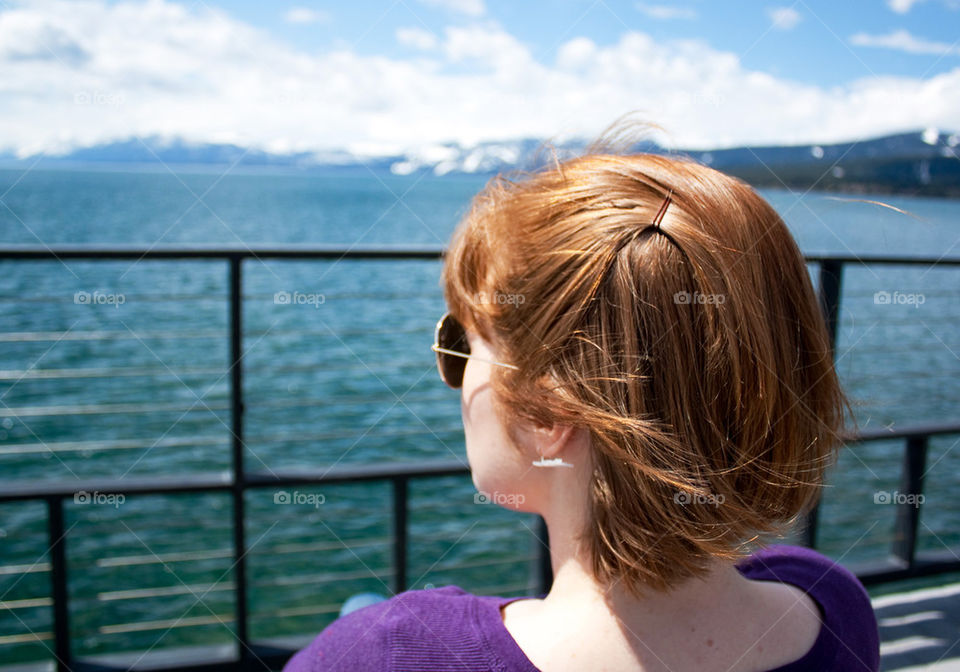 Redhead at lake