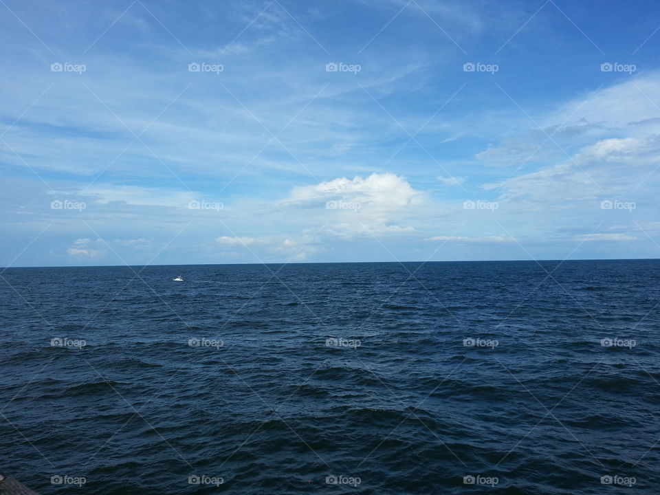 ocean. This pic was taken on the pier of Kure Beach, Wilmington, NC. It has beautiful blue sky and blue waters. Very relaxing