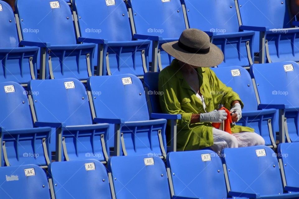 Lady on  bleachers