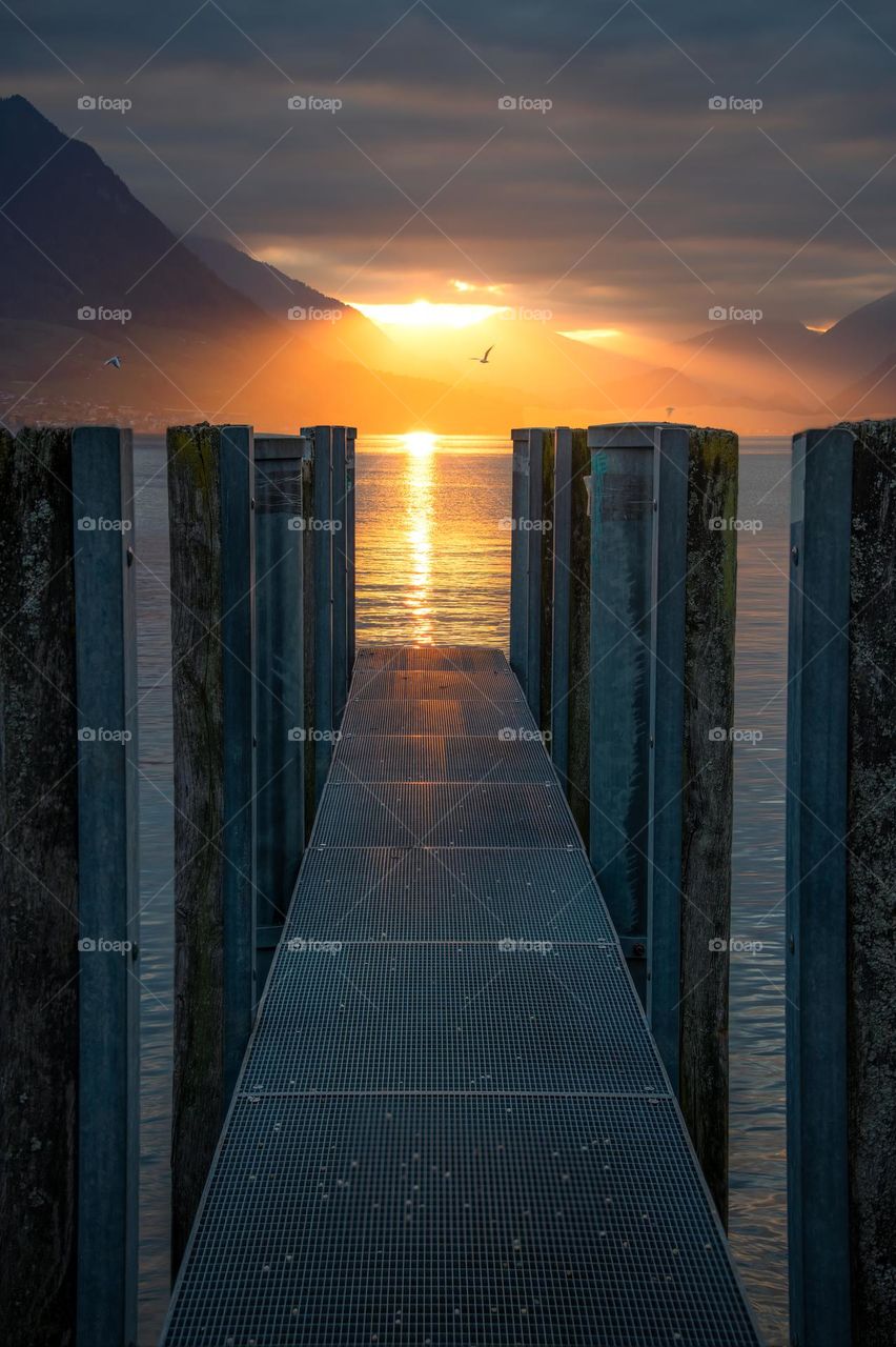 A jetty during dramatic sunset 