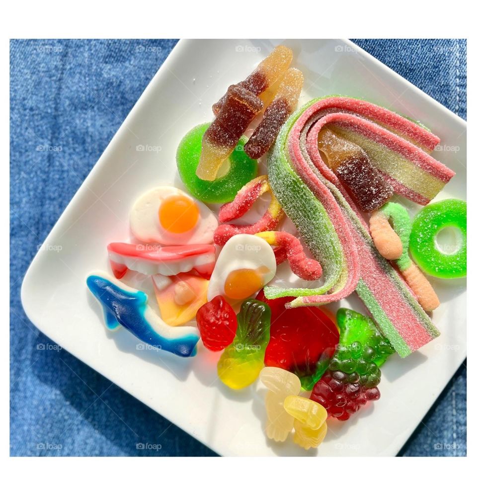 Assorted colourful rainbow fun gummies and sour strips