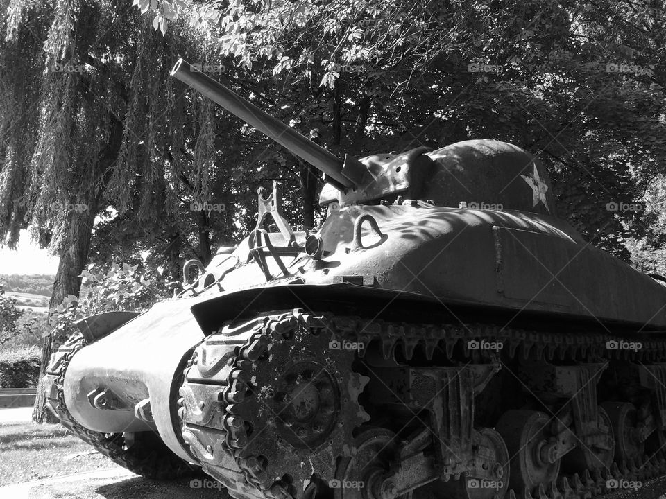 A vintage World War II American Sherman Tank on display at the Patton Memorial Museum in Luxembourg on a sunny summer day. 