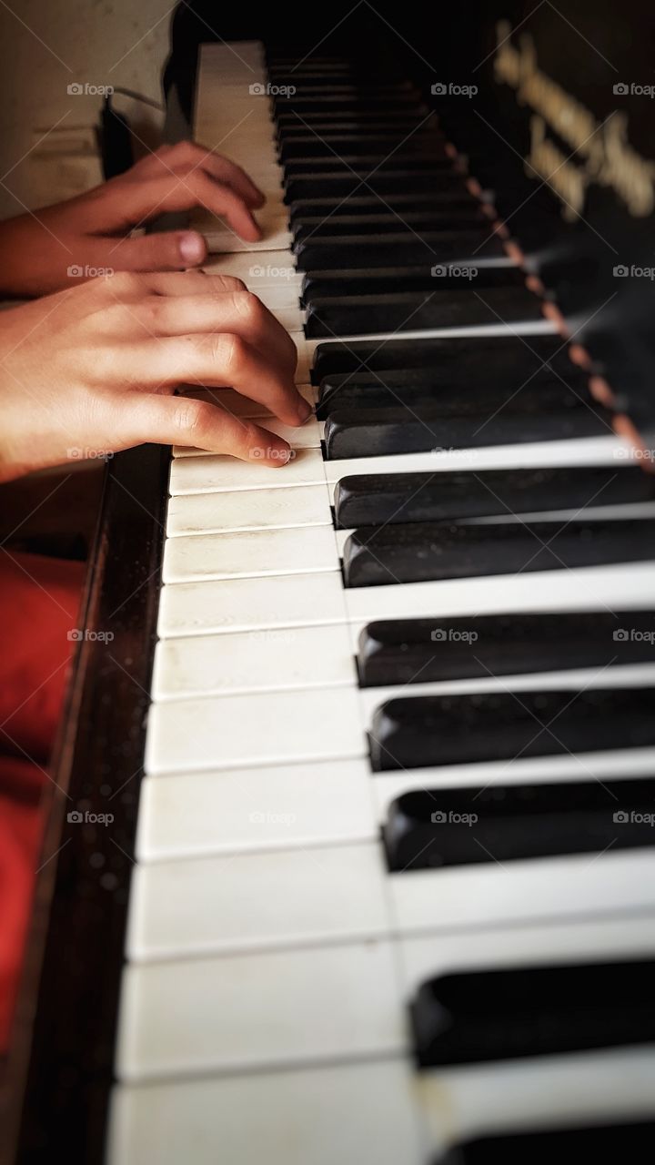 My 11 yr-old boy on the grand piano. His first time on one this size.