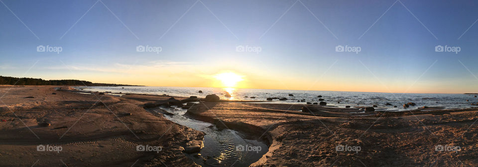 Sunset on the rocky shore