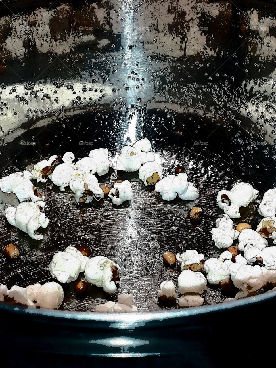 popcorn in a pan with salt